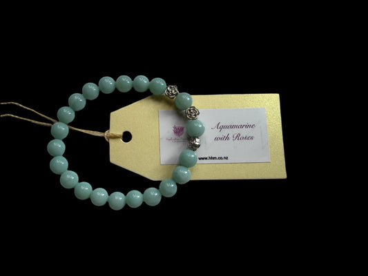 A handmade Aquamarine crystal bracelet with silver-coloured roses.