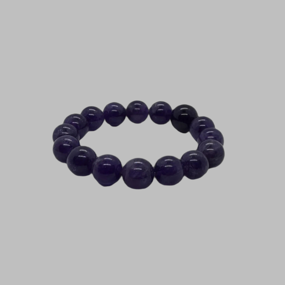 Side view of large 14mm amethyst crystal stretch bracelet