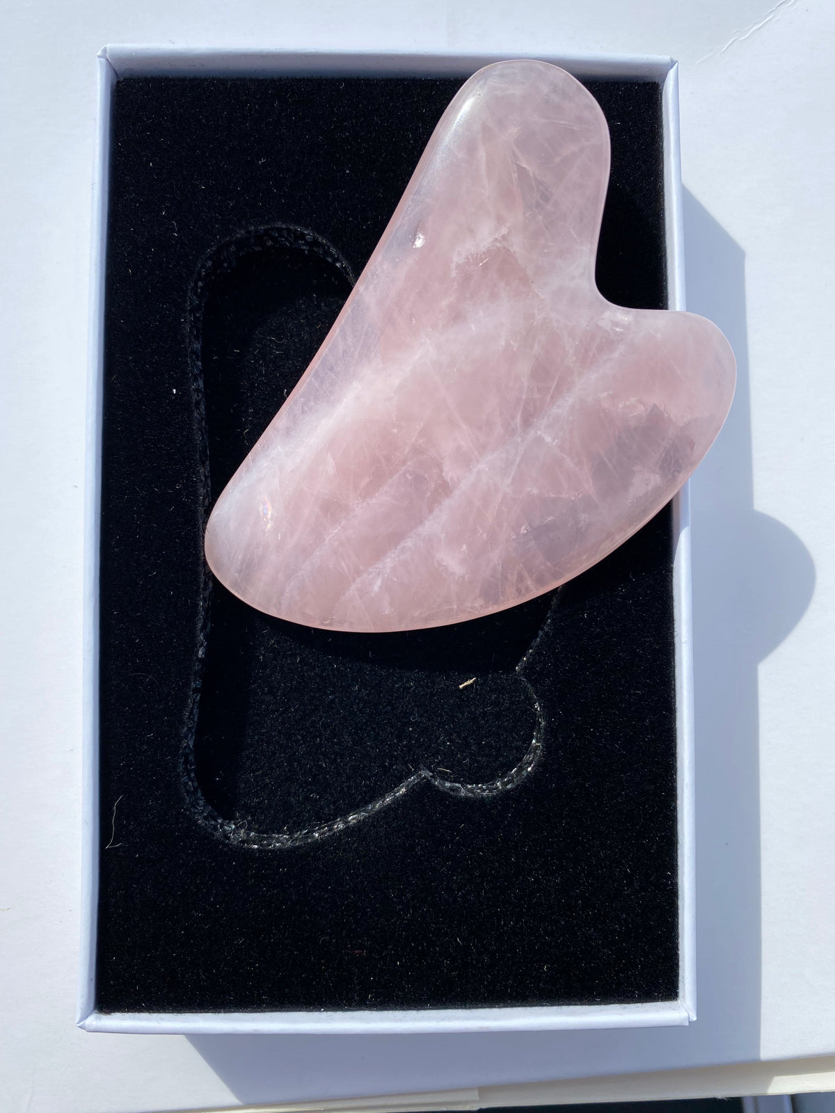 Natural rose quartz gua sha facial massage tool in presentation box