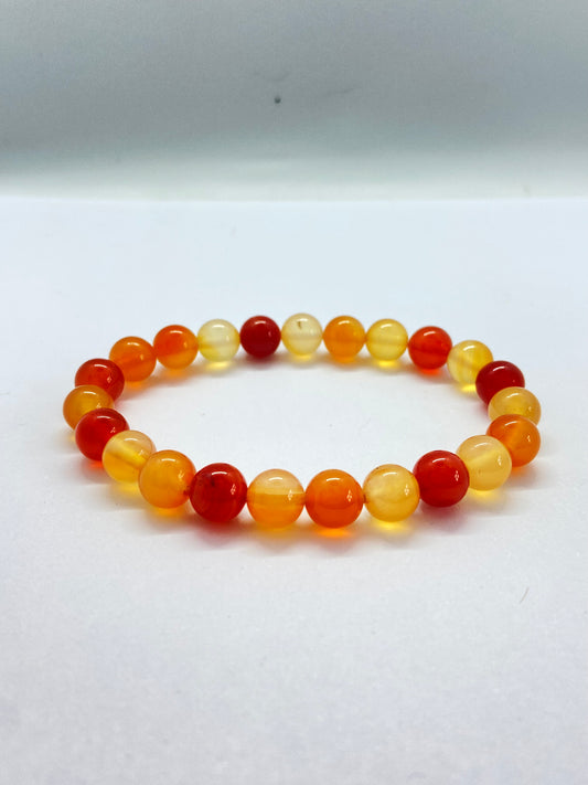 Natural carnelian crystal stretch bracelet in orange, amber and red tone